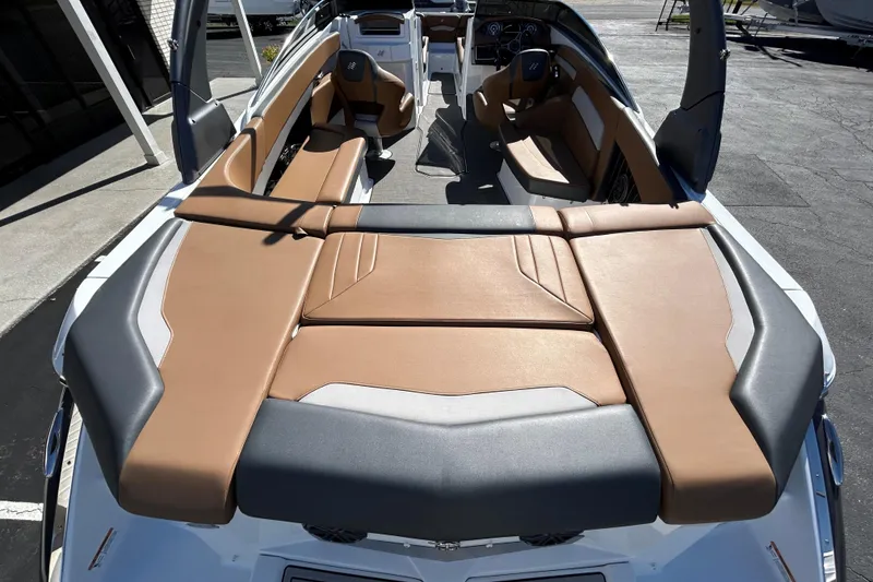 Slide: The Image of 2022 Four Winns H260 RS boat interior with tan and gray seating. - 12