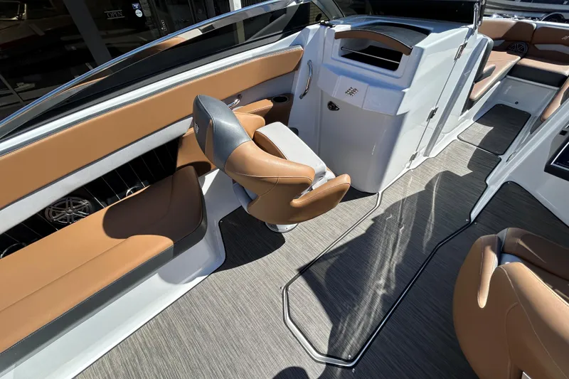Slide: The Image of 2022 Four Winns H260 RS boat interior with tan seating and modern design. - 17