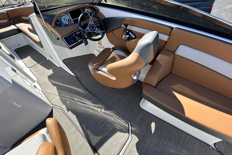 Slide: The Image of Interior of 2022 Four Winns H260 RS boat with tan seating and modern dashboard. - 18
