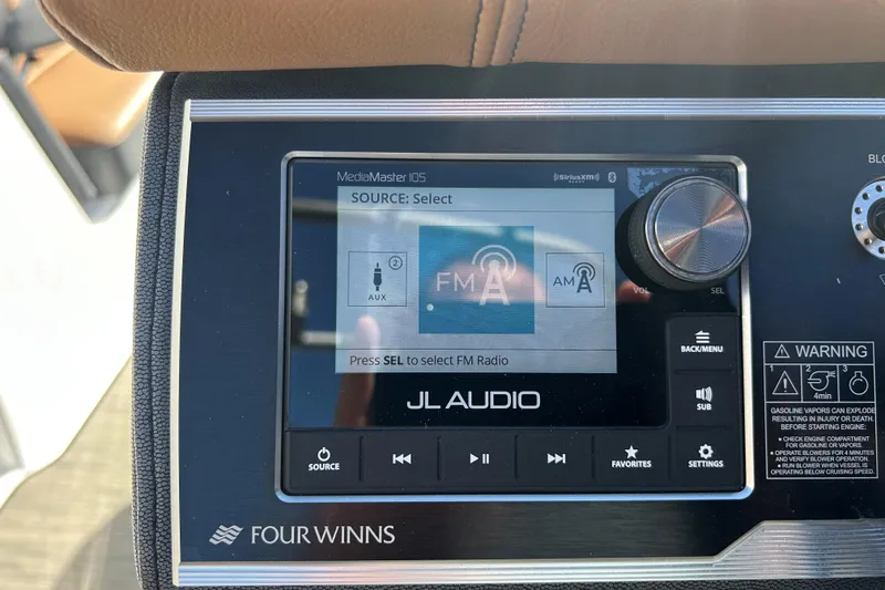 Slide: The Image of 2022 Four Winns H260 RS boat dashboard with JL Audio MediaMaster 105 display. - 20
