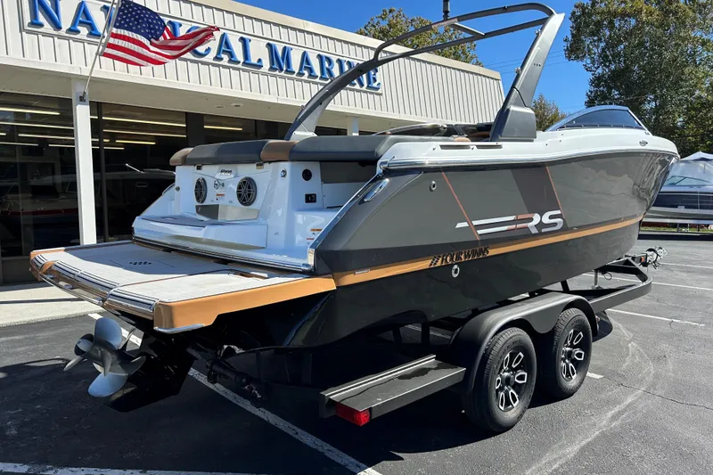 Slide: The Image of 2022 Four Winns H260 RS boat on trailer outside dealership. - 29