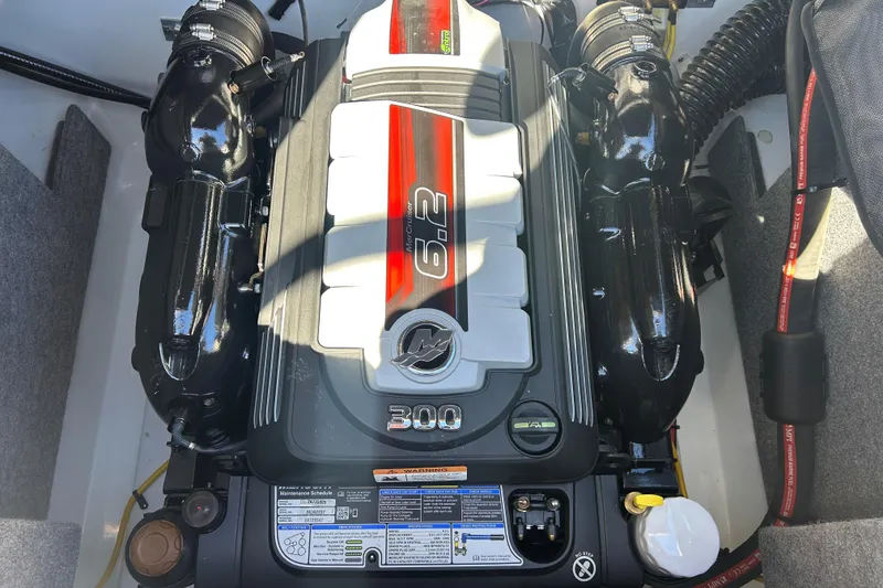 Slide: The Image of Engine of 2022 Four Winns H260 RS boat, featuring a 6.2L 300 horsepower motor. - 9