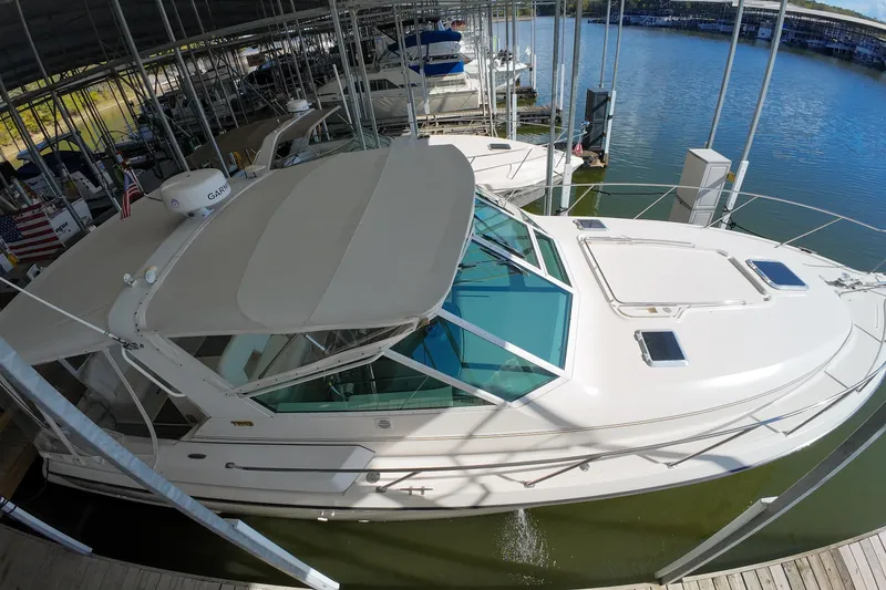 Slide: The Image of 1999 Tiara Yachts 3500 Express docked in a marina, top view. - 132