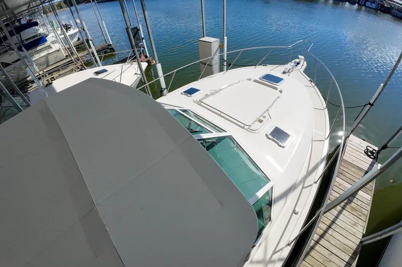 Slide: The Image of 1999 Tiara Yachts 3500 Express docked at marina, aerial view. - 134