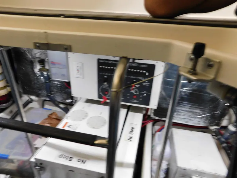 Slide: The Image of Engine room of a 1999 Tiara Yachts 3500 Express, showing control panels and equipment. - 16