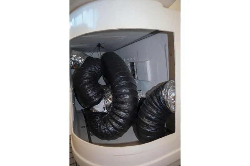 Slide: The Image of Engine compartment of a 1999 Tiara Yachts 3500 Express with ventilation ducts. - 170