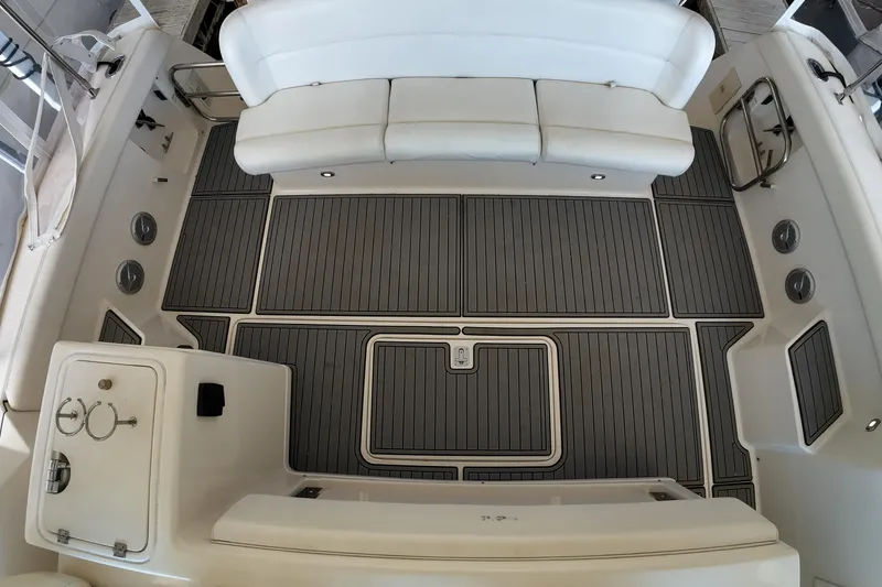 Slide: The Image of 1999 Tiara Yachts 3500 Express interior with white seating and sleek flooring. - 172