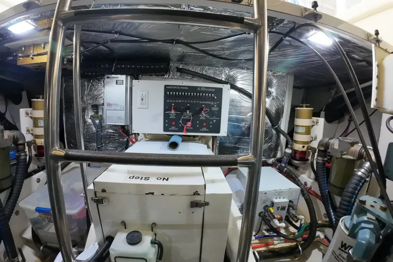 Slide: The Image of Engine room of 1999 Tiara Yachts 3500 Express with control panel and equipment. - 187