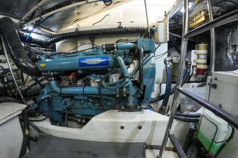 Slide: The Image of Engine room of a 1999 Tiara Yachts 3500 Express, featuring a Diamond Performance Series engine. - 189