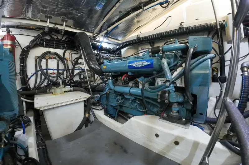 Slide: The Image of Engine room of a 1999 Tiara Yachts 3500 Express, showcasing mechanical components. - 191