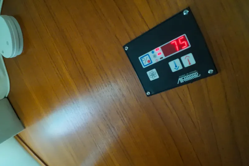 Slide: The Image of Control panel on 1999 Tiara Yachts 3500 Express, displaying temperature setting at 75 degrees. - 205