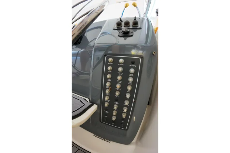 Slide: The Image of Control panel of a 1999 Tiara Yachts 3500 Express boat, featuring various switches. - 231