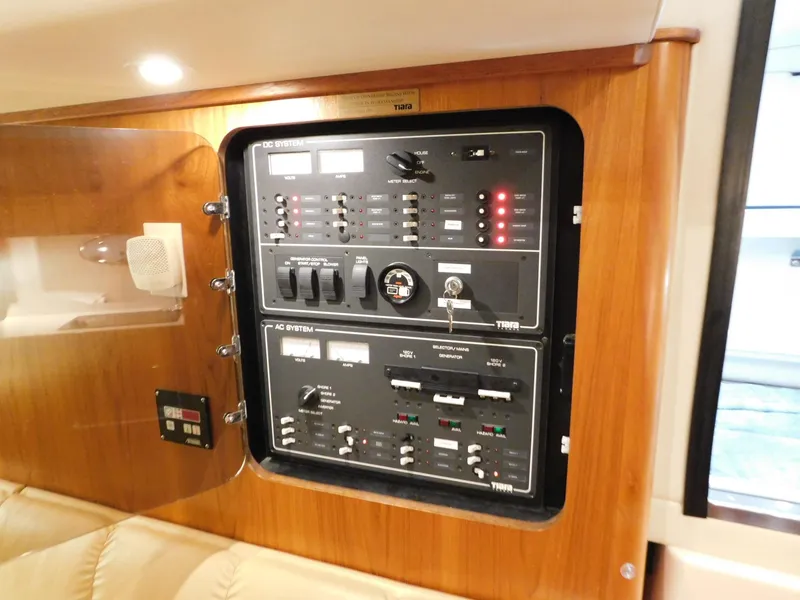 Slide: The Image of Electrical control panel on a 1999 Tiara Yachts 3500 Express boat. - 33