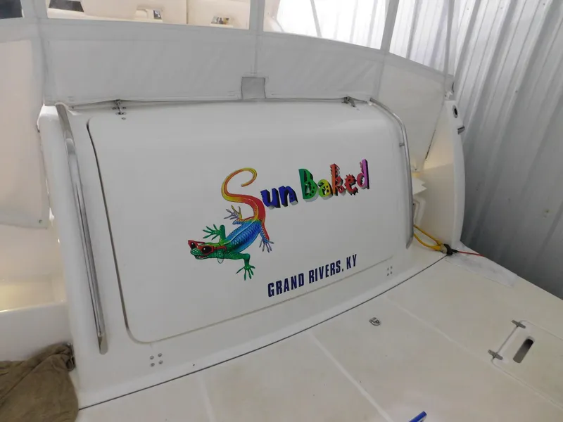 Slide: The Image of 1999 Tiara Yachts 3500 Express with colorful "Sun Baked" logo, Grand Rivers, KY. - 39
