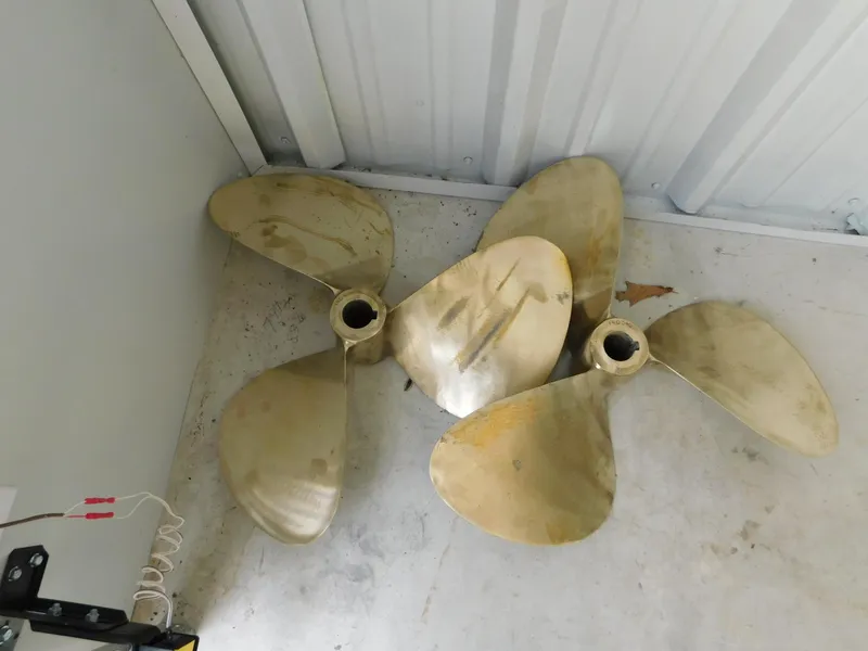 Slide: The Image of Propellers for 1999 Tiara Yachts 3500 Express, displayed on a concrete floor. - 48
