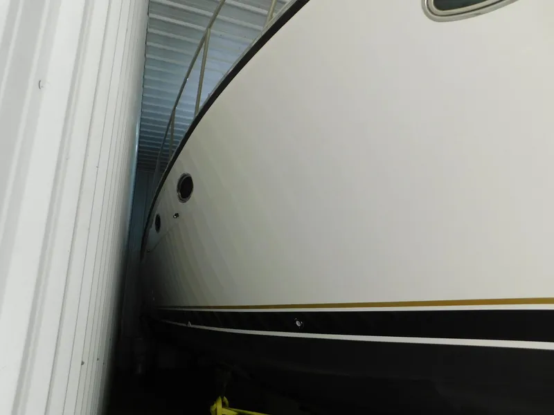 Slide: The Image of 1999 Tiara Yachts 3500 Express stored in a covered facility. - 51