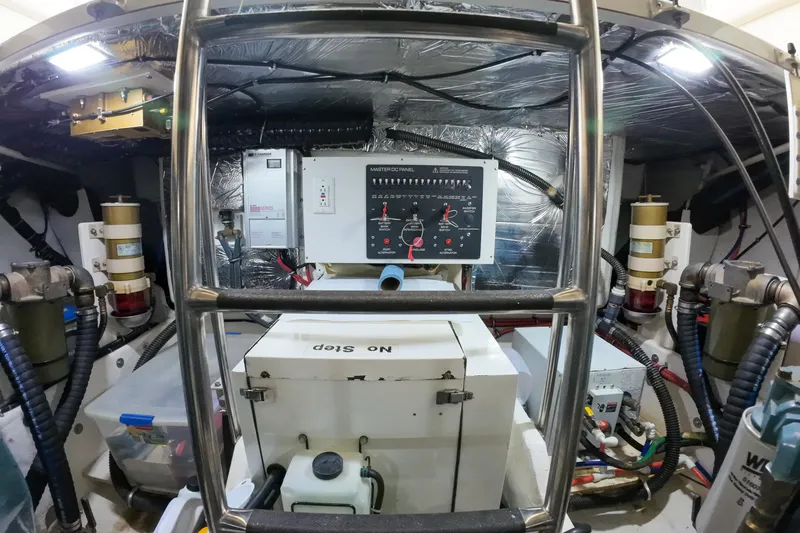 Slide: The Image of Engine room of 1999 Tiara Yachts 3500 Express with control panel and equipment. - 68