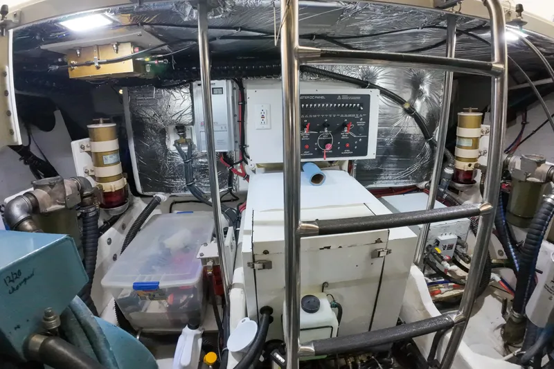 Slide: The Image of Engine room of 1999 Tiara Yachts 3500 Express with control panel and equipment. - 69