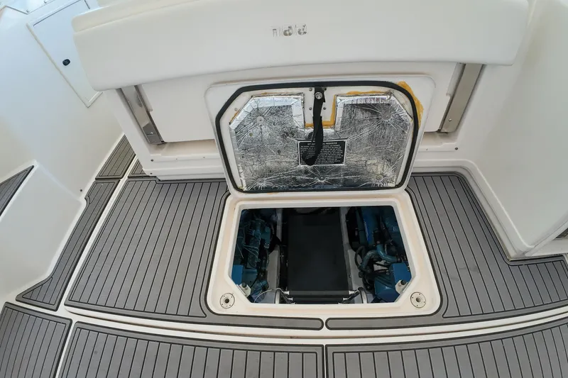 Slide: The Image of Engine compartment of 1999 Tiara Yachts 3500 Express with open hatch on deck. - 77