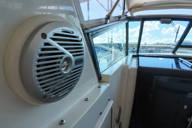 Slide: The Image of 1999 Tiara Yachts 3500 Express interior with speaker and window view. - 83