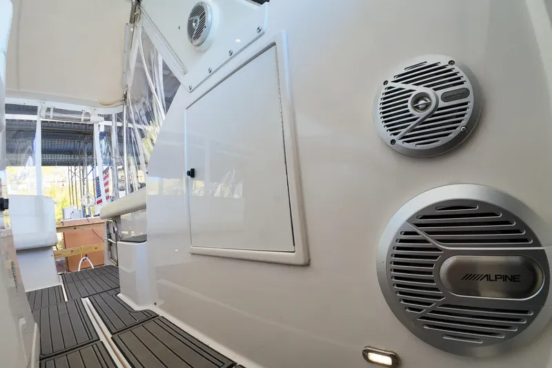 Slide: The Image of 1999 Tiara Yachts 3500 Express interior with Alpine speakers and sleek design. - 84