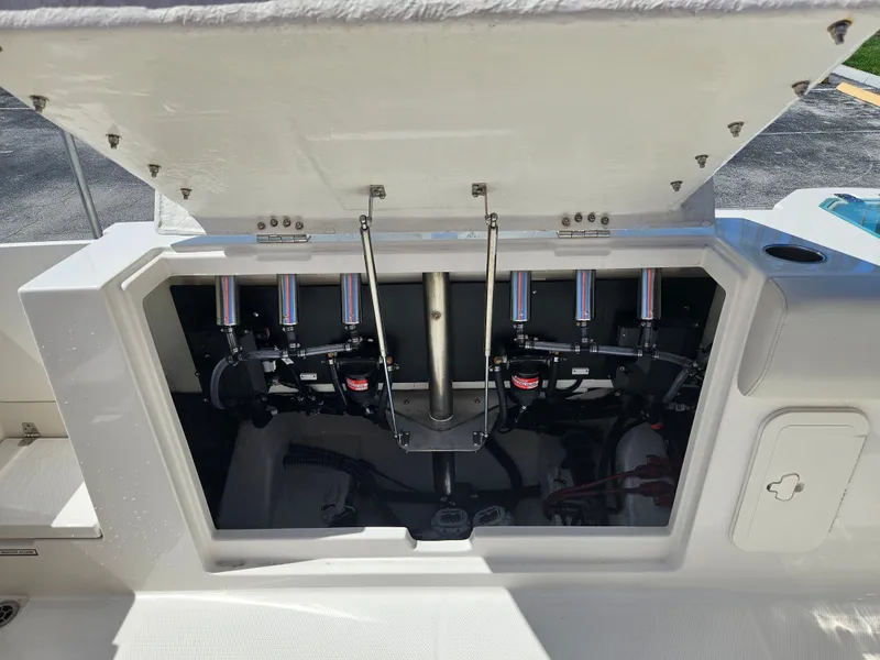 Slide: The Image of 2024 Sailfish 312CC boat engine compartment with open hatch. - 11