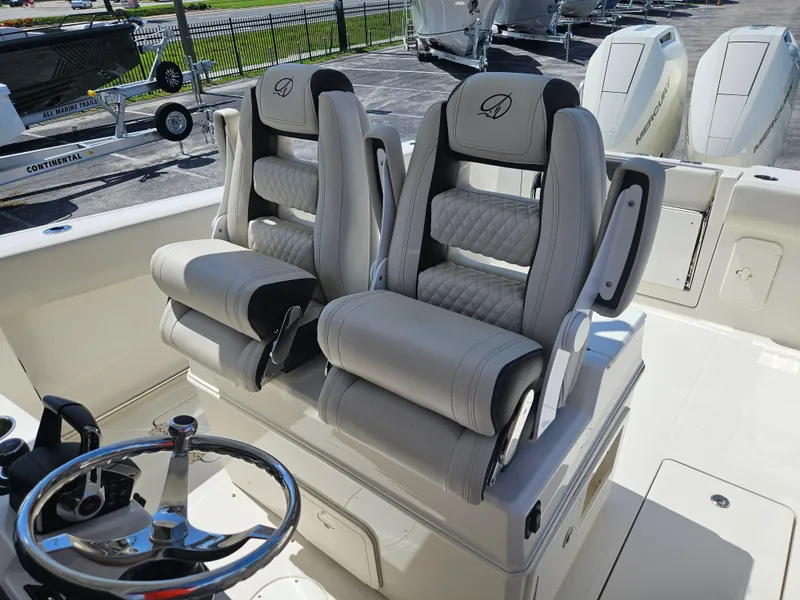 Slide: The Image of 2024 Sailfish 312CC boat with dual captain's chairs and steering wheel. - 20