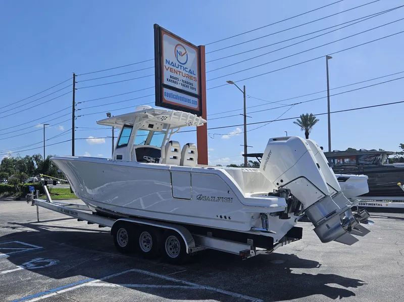 Slide: The Image of 2024 Sailfish 312CC boat on a trailer at a dealership. - 3