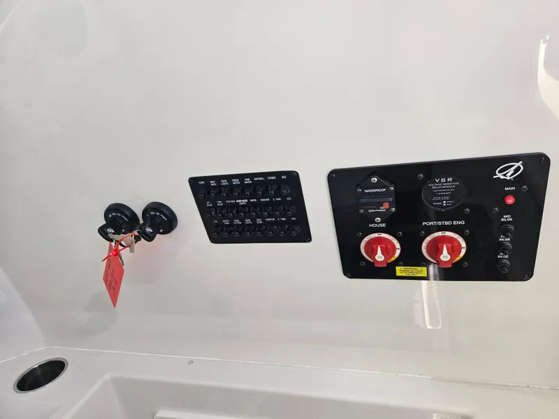 Slide: The Image of Control panel of 2024 Sailfish 312CC boat with switches and knobs. - 32