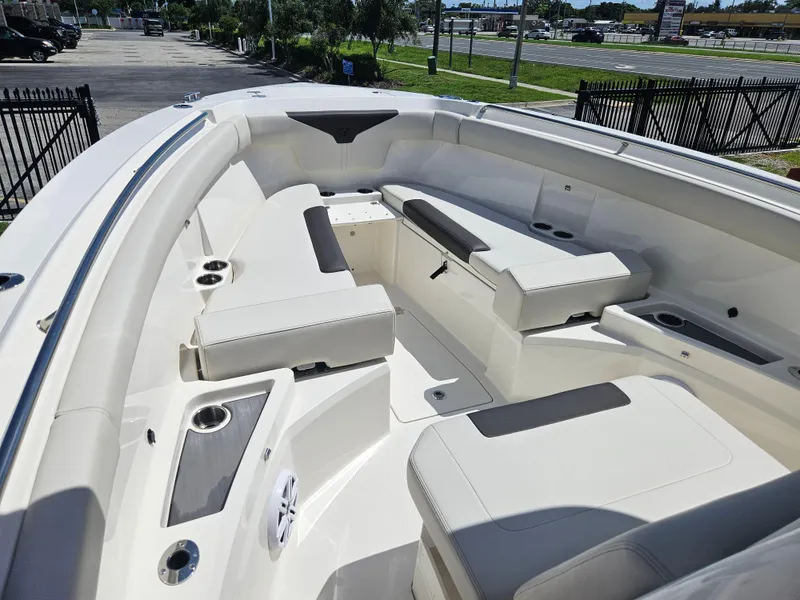Slide: The Image of 2024 Sailfish 312CC boat interior with spacious seating and cup holders. - 35