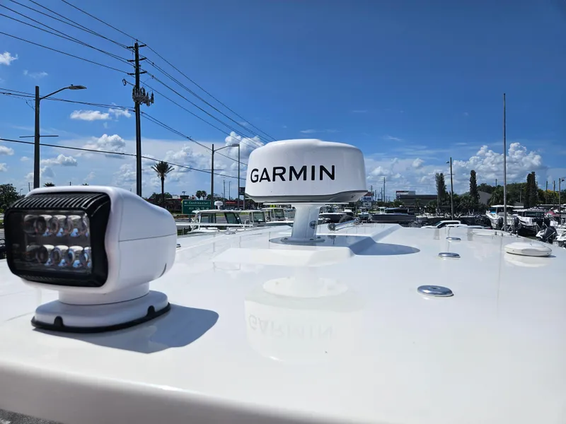 Slide: The Image of 2024 Sailfish 312CC boat with Garmin radar and spotlight. - 44
