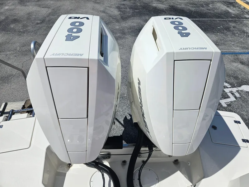 Slide: The Image of Twin Mercury 400 outboard engines on a 2024 Sailfish 312CC boat. - 8
