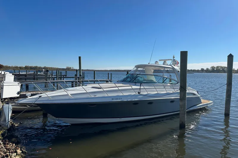 The Image of 2004 Formula 48 Yacht docked on a sunny day, calm waters in the background. - 0