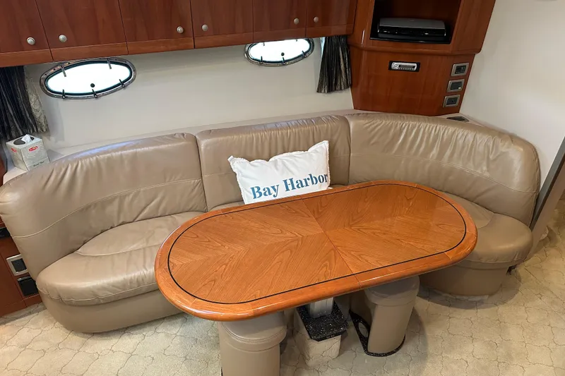 Slide: The Image of Interior of 2004 Formula 48 Yacht with leather seating and wooden table. - 16