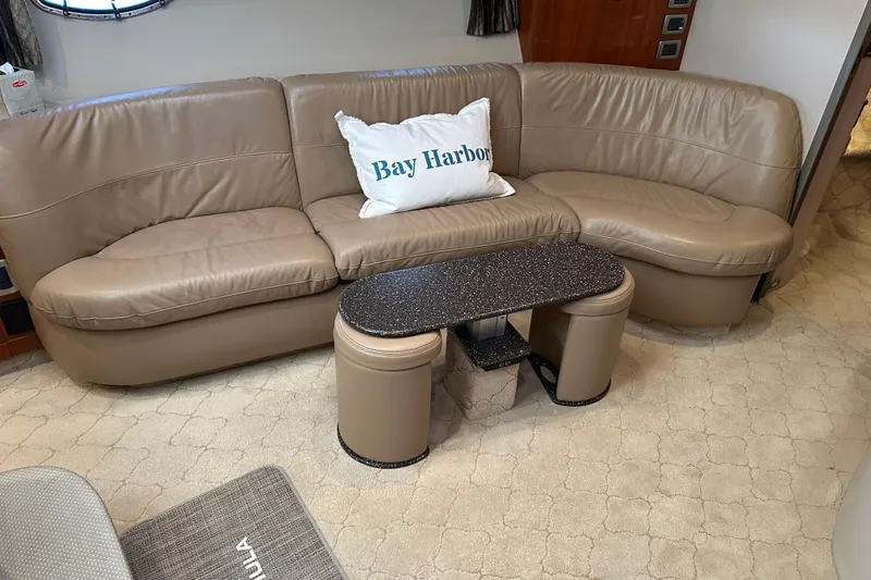 Slide: The Image of Luxurious interior of 2004 Formula 48 Yacht with beige leather seating and stylish decor. - 19