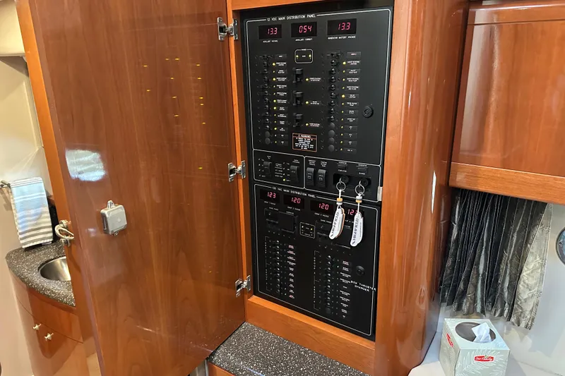Slide: The Image of Electrical panel inside 2004 Formula 48 Yacht, featuring control switches and digital displays. - 20