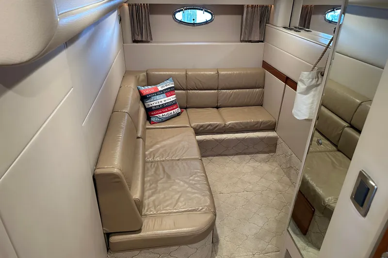 Slide: The Image of Luxurious interior of 2004 Formula 48 Yacht with beige leather seating and decorative pillow. - 23