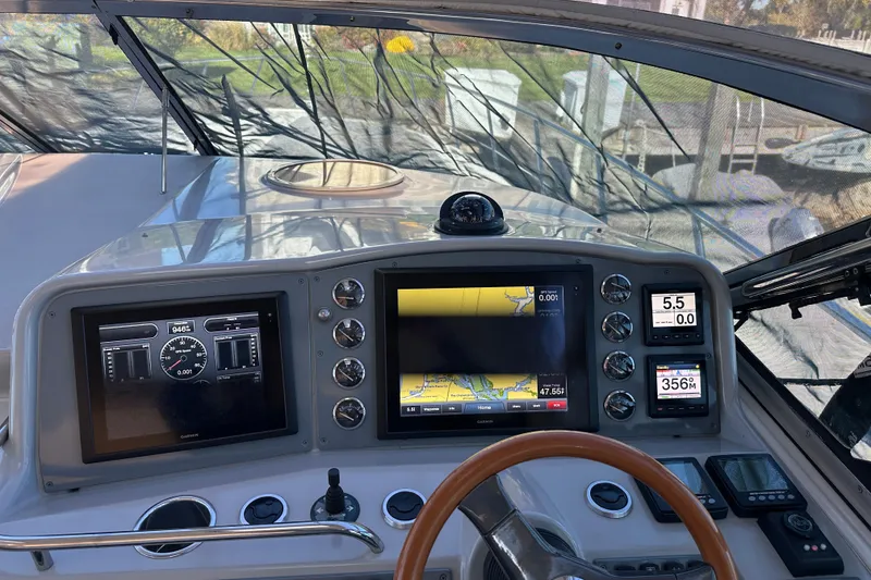 Slide: The Image of 2004 Formula 48 Yacht dashboard with navigation screens and controls. - 35
