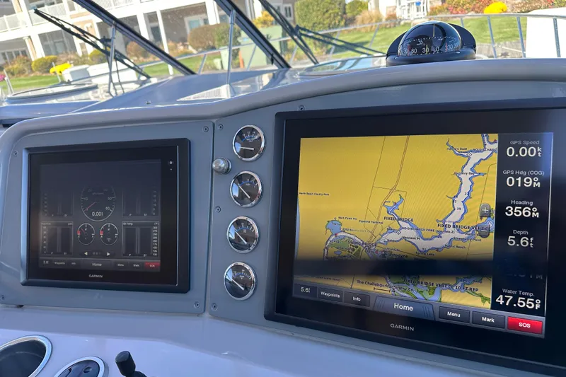 Slide: The Image of Dashboard of a 2004 Formula 48 Yacht with Garmin navigation displays. - 36