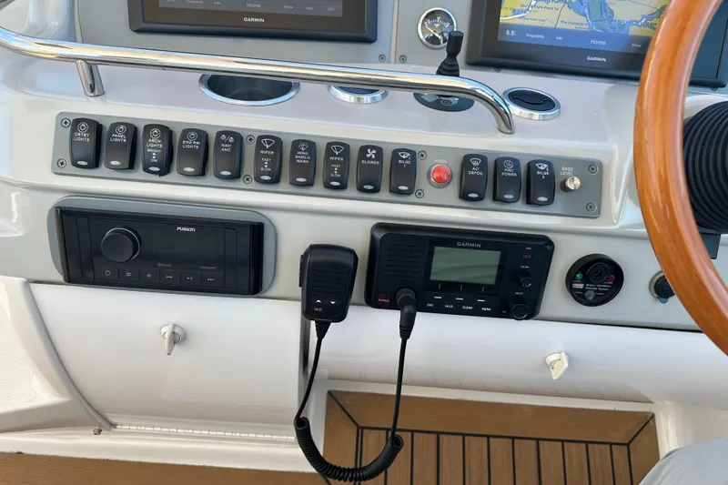 Slide: The Image of Control panel of a 2004 Formula 48 Yacht with navigation and communication equipment. - 39