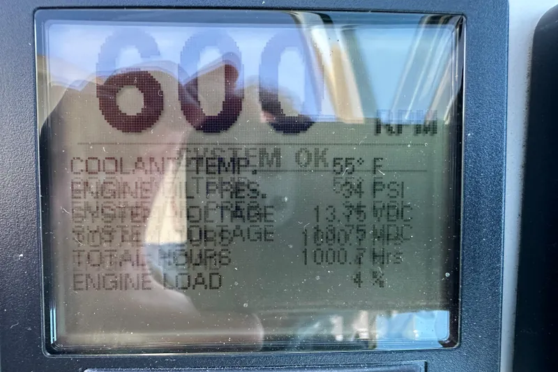 Slide: The Image of Display screen showing engine data for 2004 Formula 48 Yacht, including RPM and coolant temperature. - 40