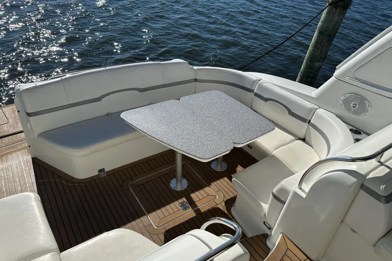 Slide: The Image of 2004 Formula 48 Yacht deck with seating and table, overlooking water. - 44