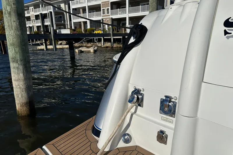 Slide: The Image of 2004 Formula 48 Yacht docked near waterfront buildings. - 47