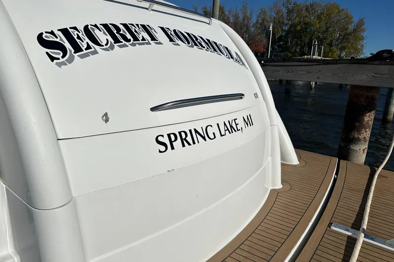 Slide: The Image of 2004 Formula 48 Yacht docked in Spring Lake, MI, with "Secret Formula" name. - 48