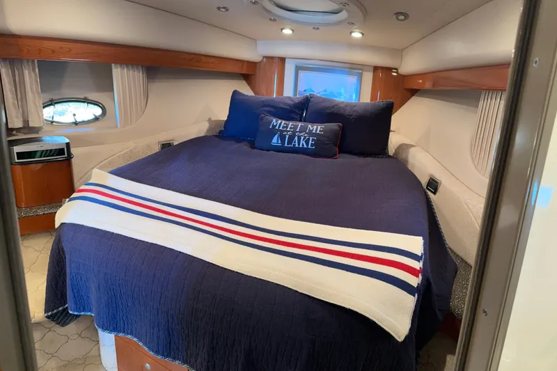 Slide: The Image of Luxurious 2004 Formula 48 Yacht bedroom with cozy bedding and nautical decor. - 5