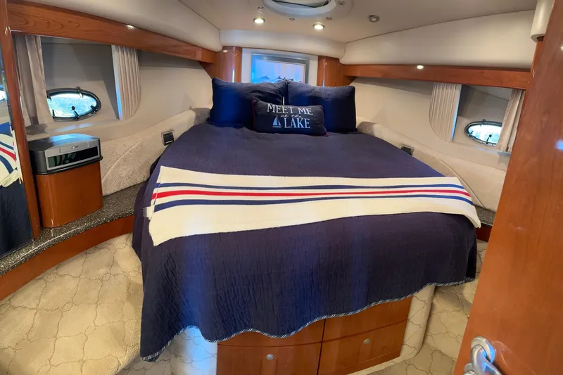 Slide: The Image of Luxurious bedroom interior of 2004 Formula 48 Yacht with cozy bedding and elegant decor. - 6
