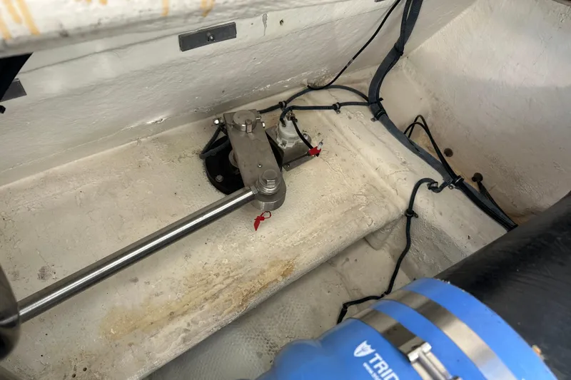 Slide: The Image of Engine compartment of a 2004 Formula 48 Yacht, showcasing mechanical components and wiring. - 61