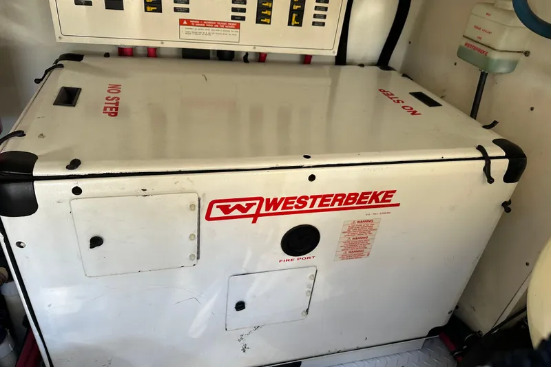 Slide: The Image of Westerbeke generator in a 2004 Formula 48 Yacht engine room, labeled "No Step." - 67