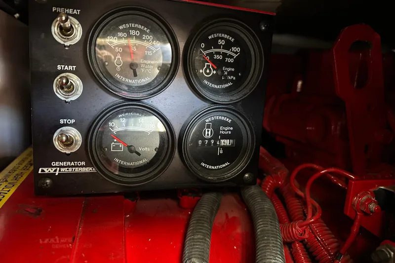 Slide: The Image of Control panel of a 2004 Formula 48 Yacht with Westerbeke generator gauges. - 68