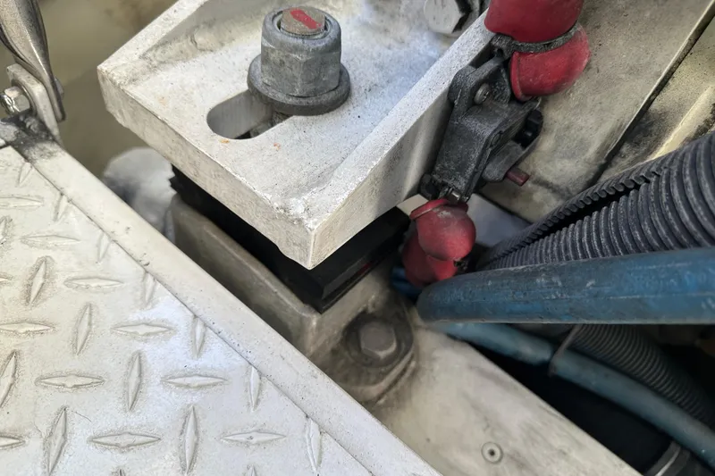 Slide: The Image of Engine compartment of a 2004 Formula 48 Yacht, showing mechanical components and wiring. - 70